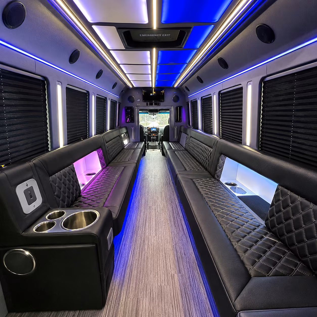 Friends laughing during a party bus celebration in Pompano Beach